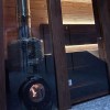 Дровяная печь IKI Loyly со стеклянной дверцей в интерьере
